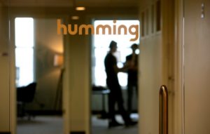Image of Humming office door printed with company name